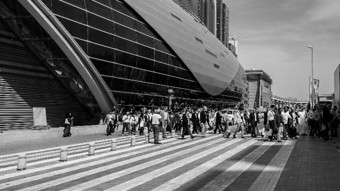 grayscale photo of people walking on street